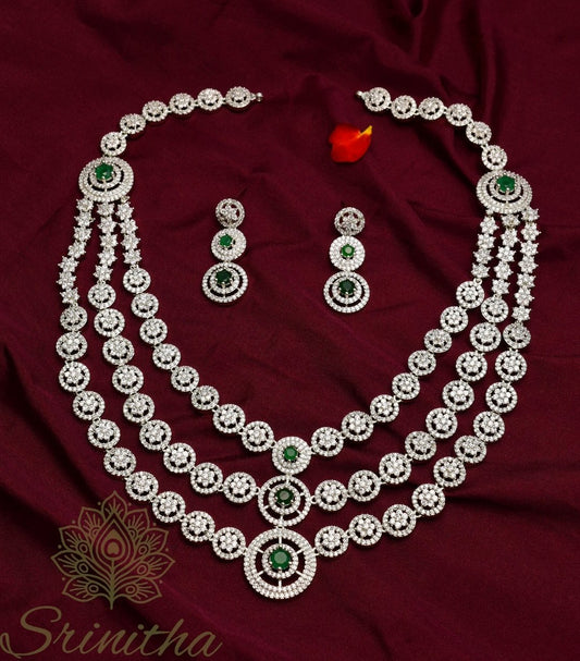 Vishruta Set – Emerald-Centered Triple-Layer CZ Necklace in Silver Finish