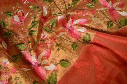 Kesarika – Jacquard Tissue Saree in Warm Orange with Embroidered Florals