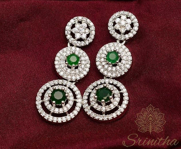 Vishruta Set – Emerald-Centered Triple-Layer CZ Necklace in Silver Finish