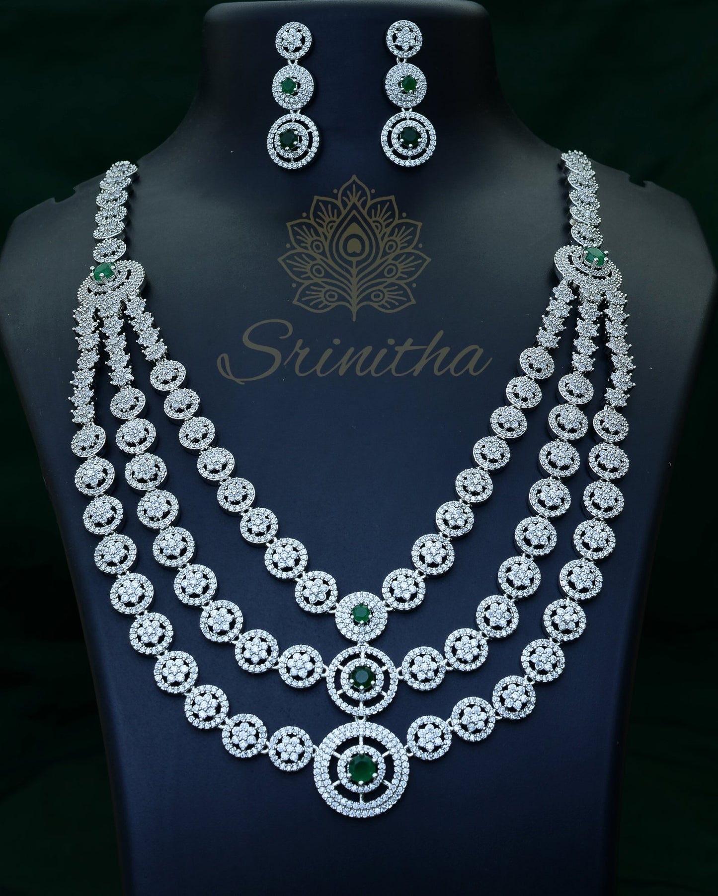 Vishruta Set – Emerald-Centered Triple-Layer CZ Necklace in Silver Finish
