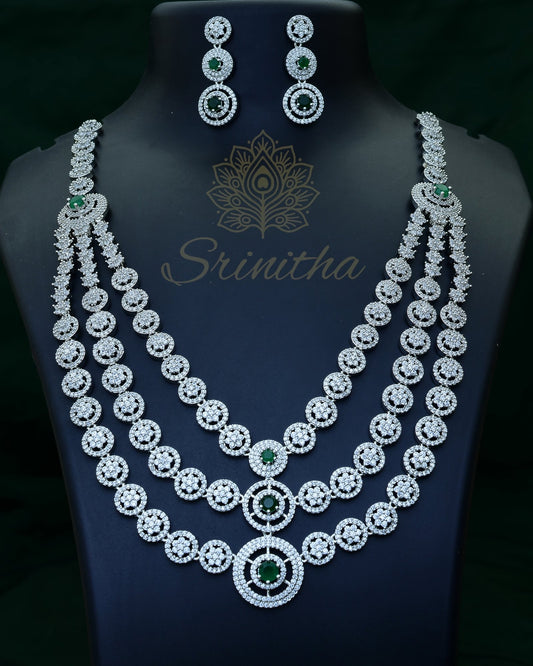 Vishruta Set – Emerald-Centered Triple-Layer CZ Necklace in Silver Finish